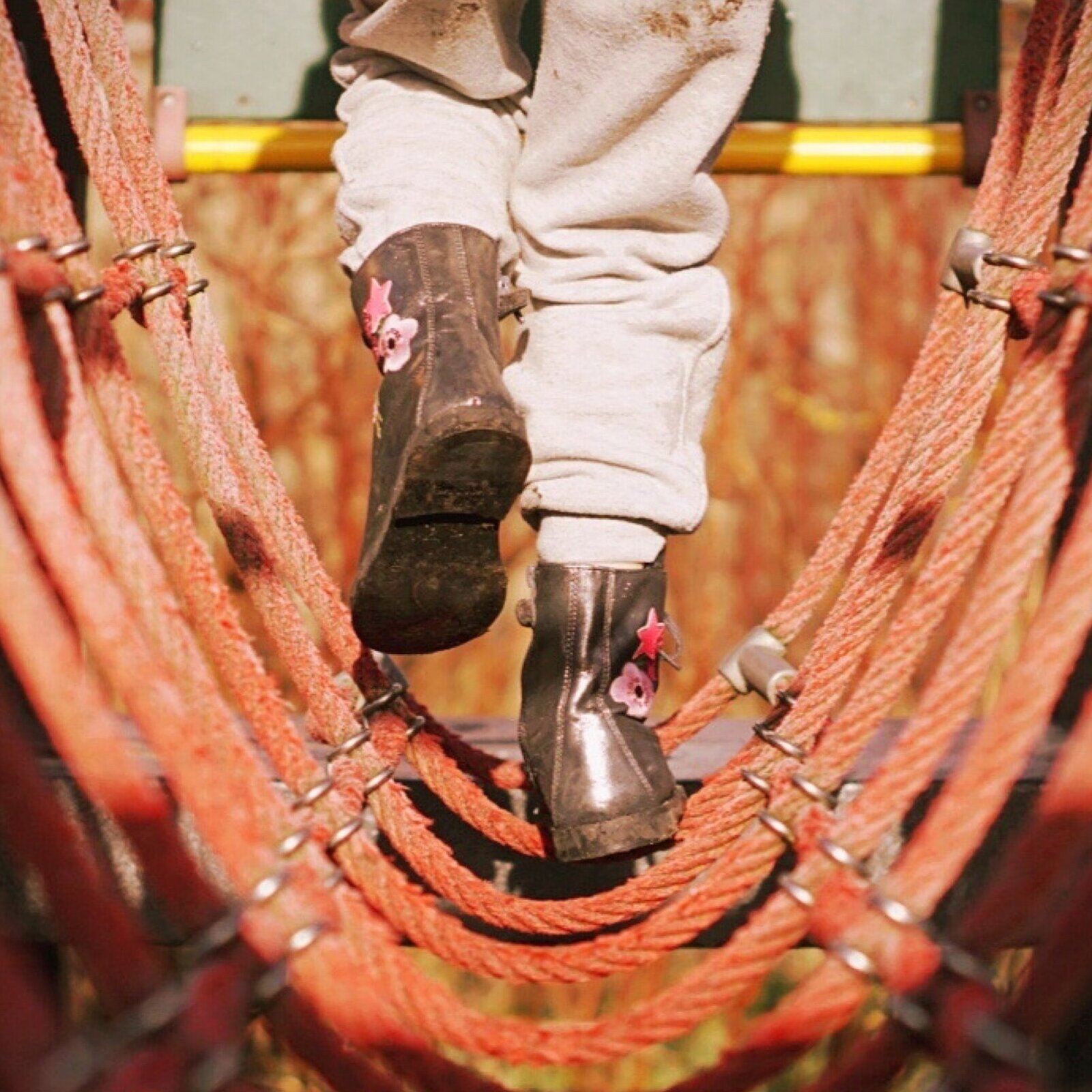 person climbing on rope